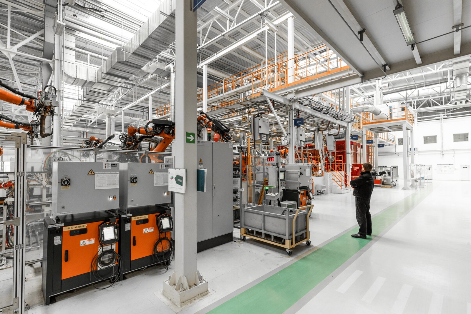 Home photo of automobile production line. welding car body. modern car assembly plant. auto industry. interior of a high tech factory, modern production